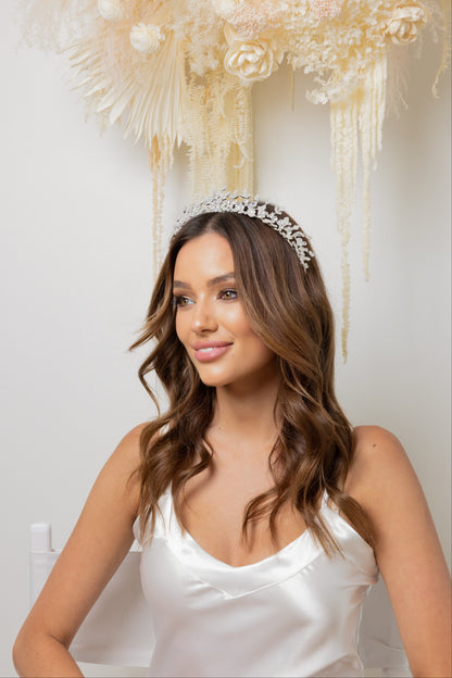 A beautiful lady wearing an elegant Ela bridal tiara with dazzling jewels