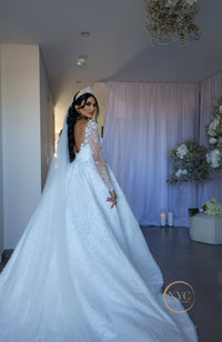 A bride in a wedding gown with a stunning Hayal bridal tiara on her head