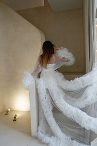 Bride wearing Elenora bridal ruffles robe posing for a photo on a staircase