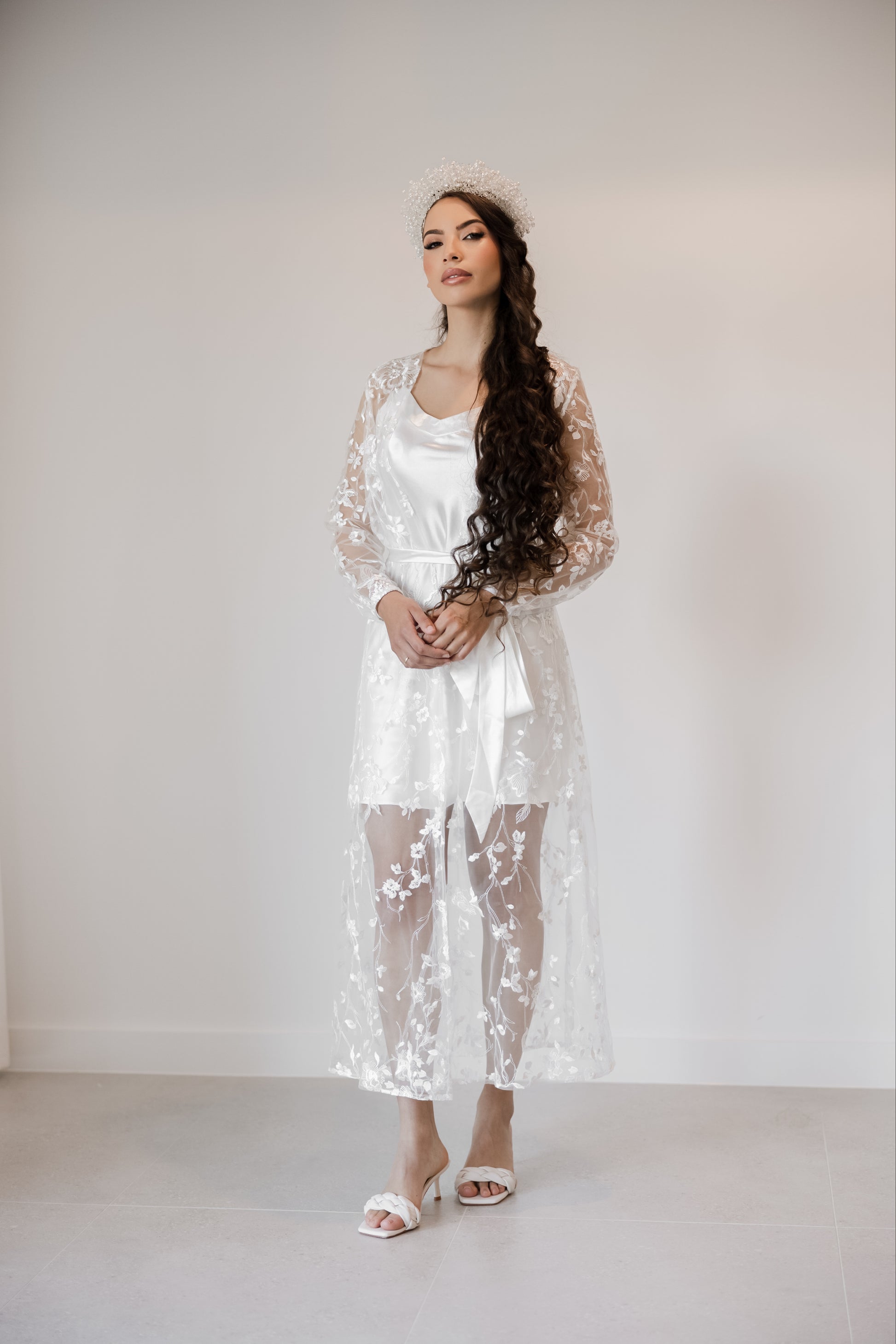Image of a woman in white lace, bridal short slip